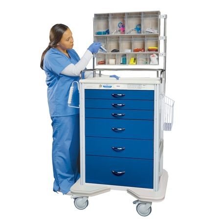 A healthcare professional interacting with a blue aluminum medical cart with multiple drawers and a slide-thru side shelf.