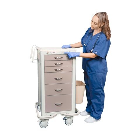 A healthcare professional in blue scrubs is interacting with a narrow, aluminum medical cart with multiple drawers. The cart is equipped with a lock mechanism and the person is using a key override.