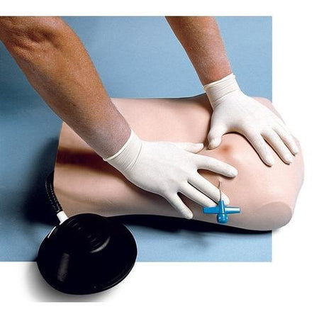A simulated torso with rib cage and vinyl skin, being used for medical training. The image shows a person's hands in white gloves performing a technique on the torso, which is lying flat.
