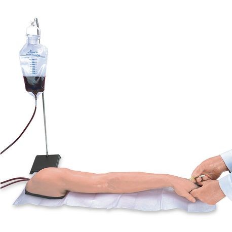 A training arm mannequin with a simulated basilic vein, accompanied by a fluid bag and syringes for injection training.