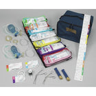 Assorted medical equipment and pouches arranged on a table, including Broselow Pediatric Emergency Tape and various procedural modules in seven pouches, with a heavy-duty ALS equipment organizer and additional equipment visible.