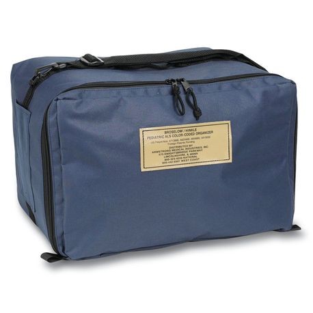 A medical professional standing next to a yellow and white medical cart with multiple drawers.