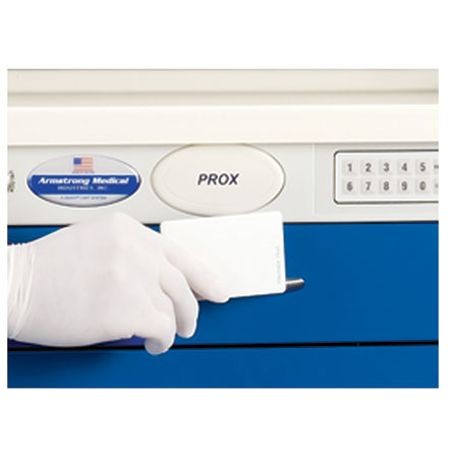 A proximity reader device with a keypad and a label that reads 'Armstrong Medical PROX'. A hand with a white glove is using the device to open a blue cabinet.