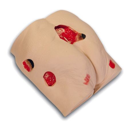A wound care simulator featuring realistic representations of various wound stages and complications, with visible red simulate blood and tissue details.